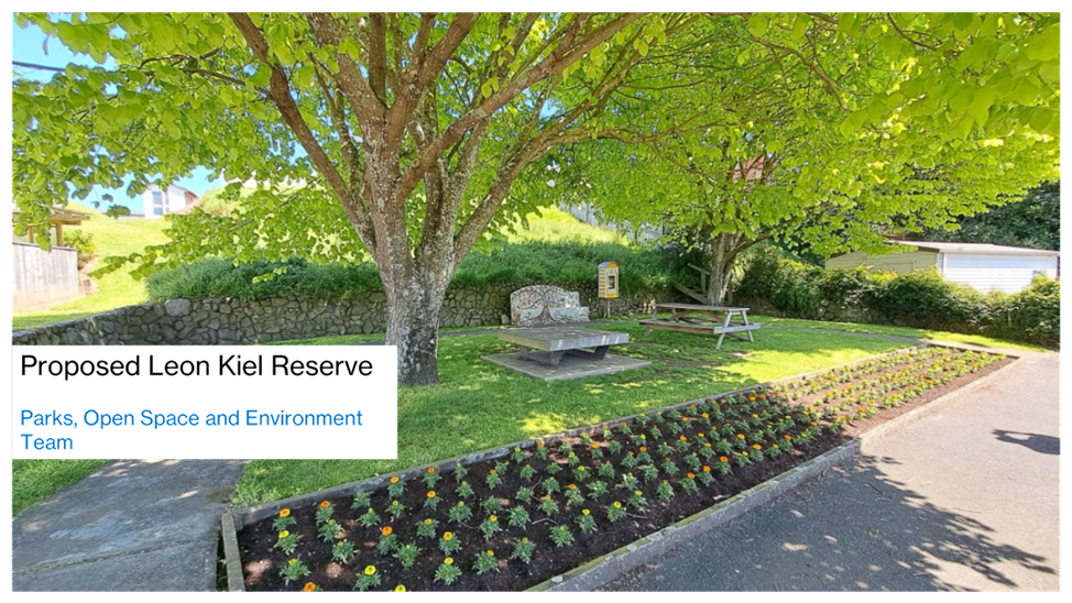 A tree with a bench and a bench in a park

Description automatically generated with medium confidence
